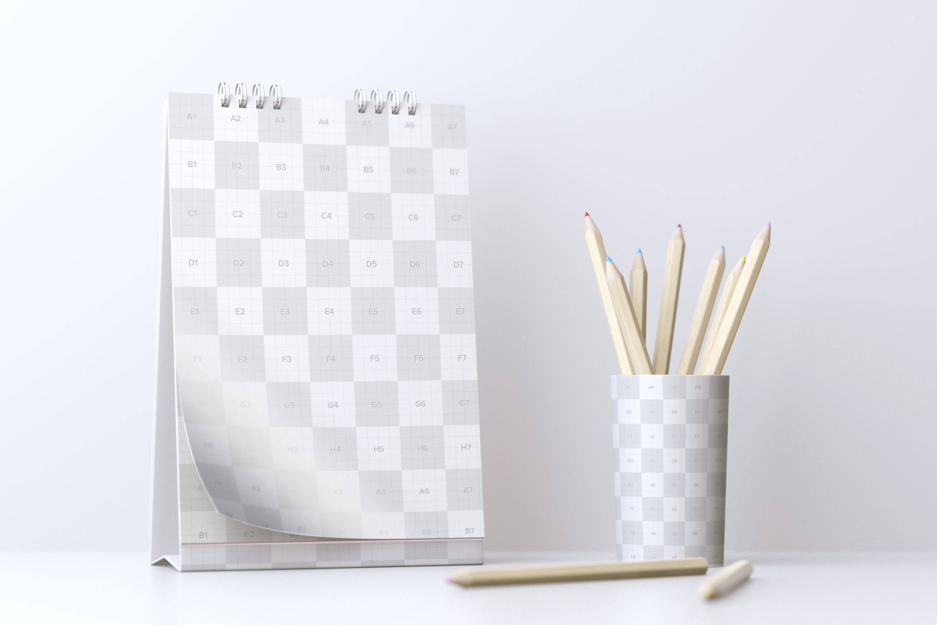 创意活页桌面日历设计样机模板 Desktop Portrait Calendar Mockup With Cup of Pencils