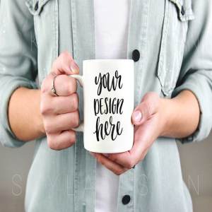手持马克杯样机模板 Woman holding white mug mockup